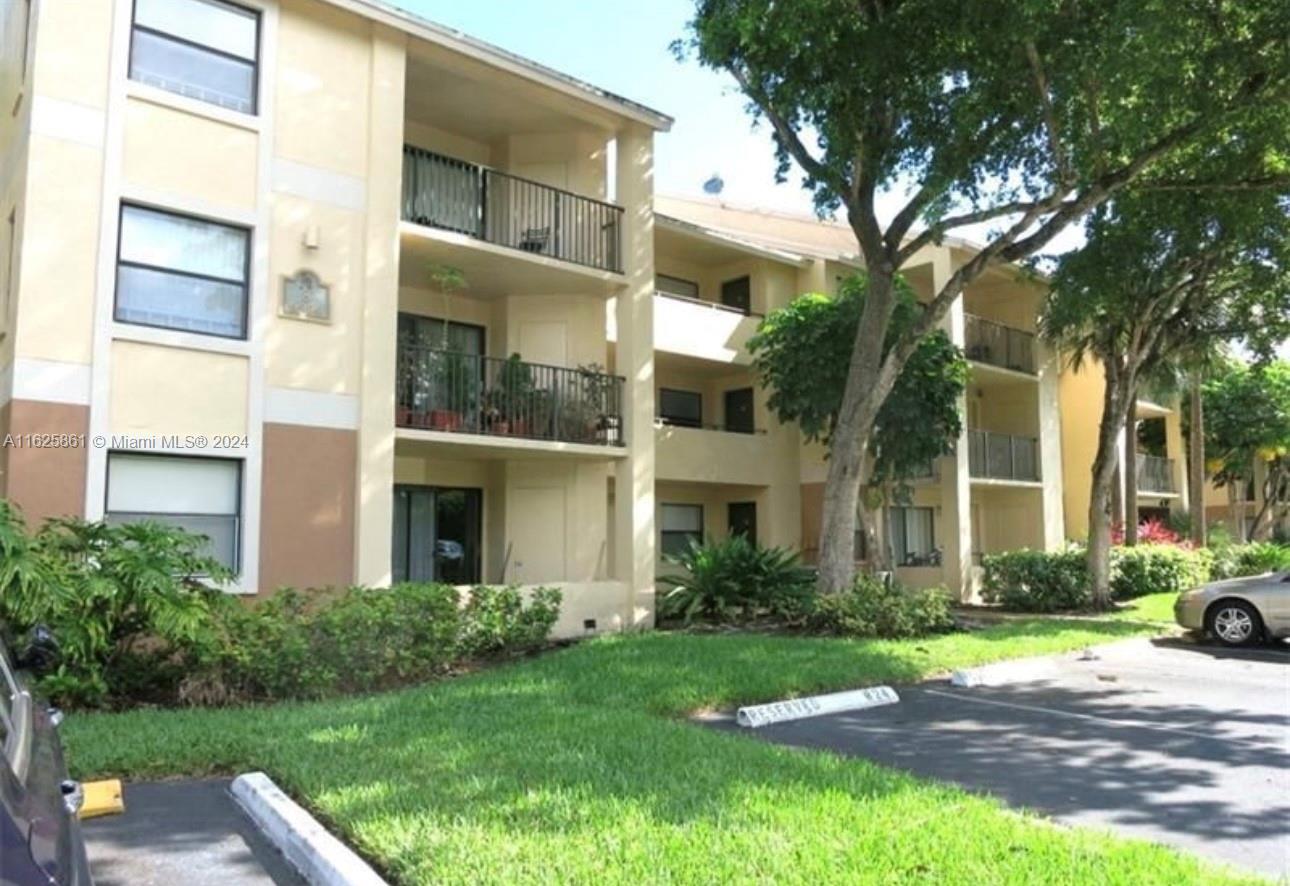 a view of a building with a yard