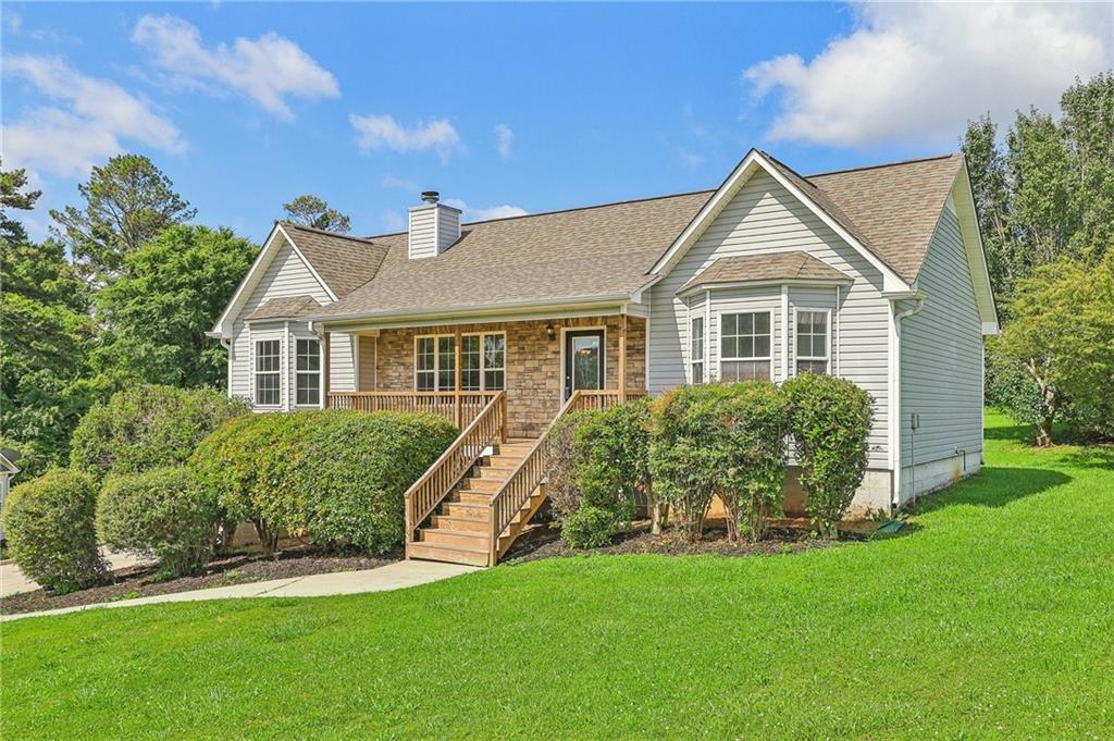 a front view of a house with a yard