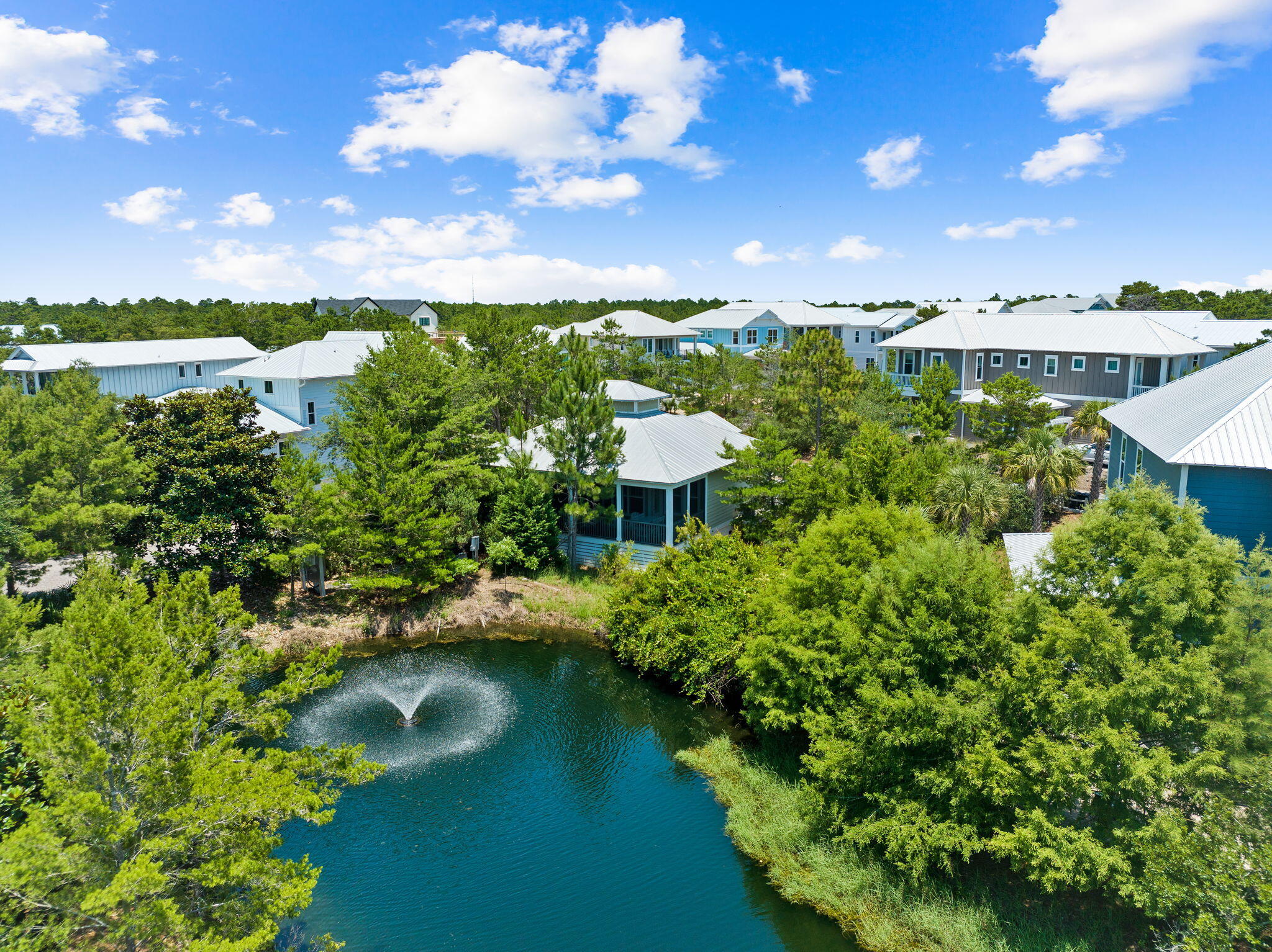 a view of a lake with houses in the back