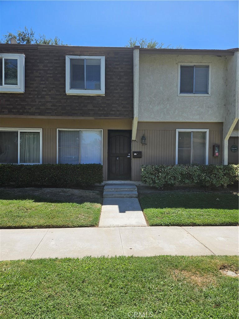 a front view of a house with yard