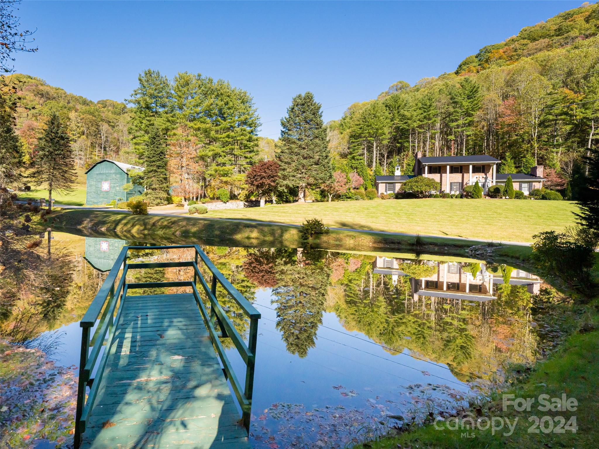 a view of a swimming pool with a lake view