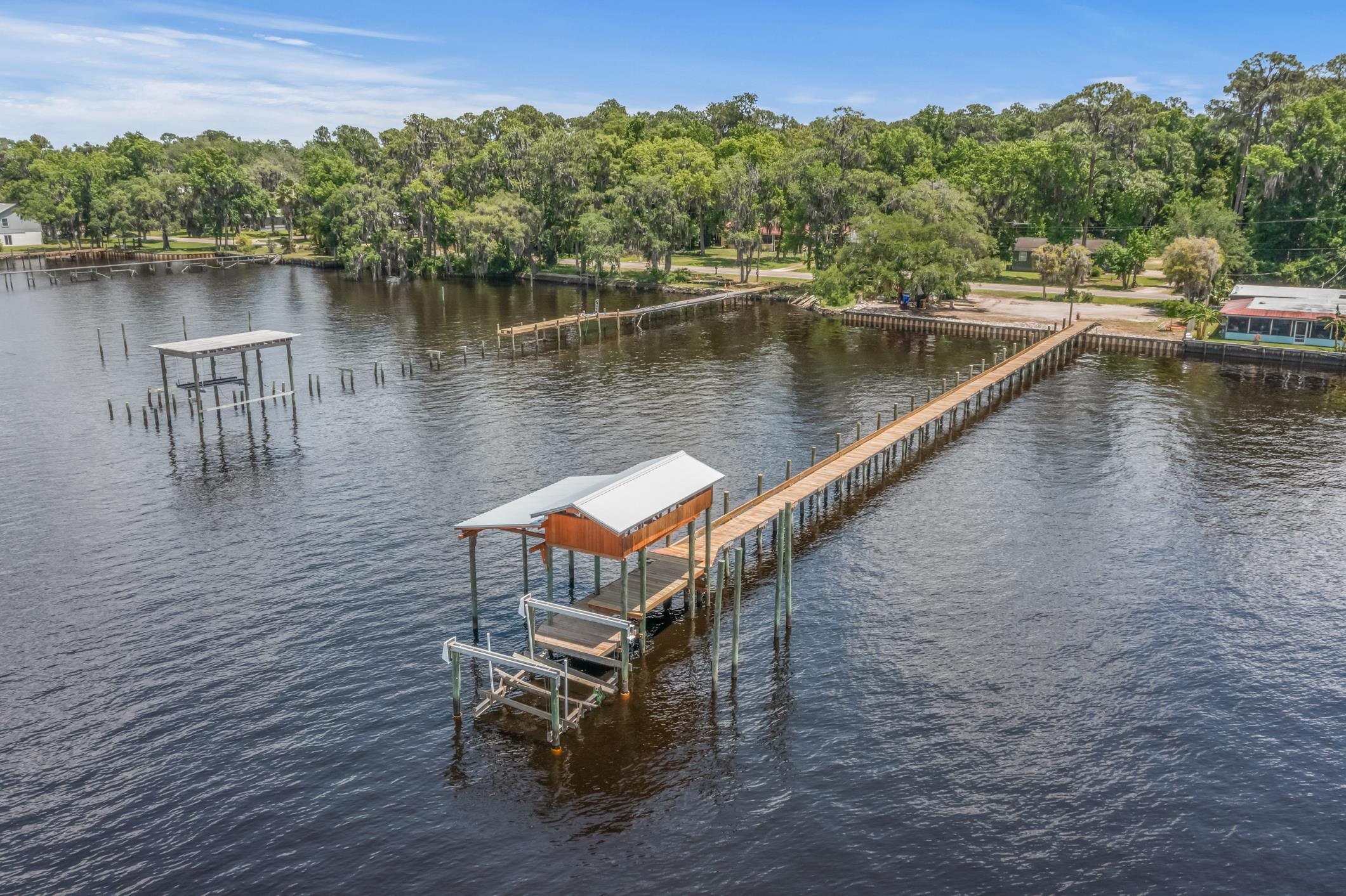 a view of a lake with a yard from a lake