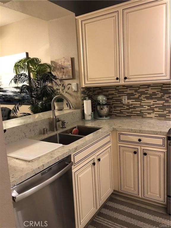 a kitchen with a sink and cabinets