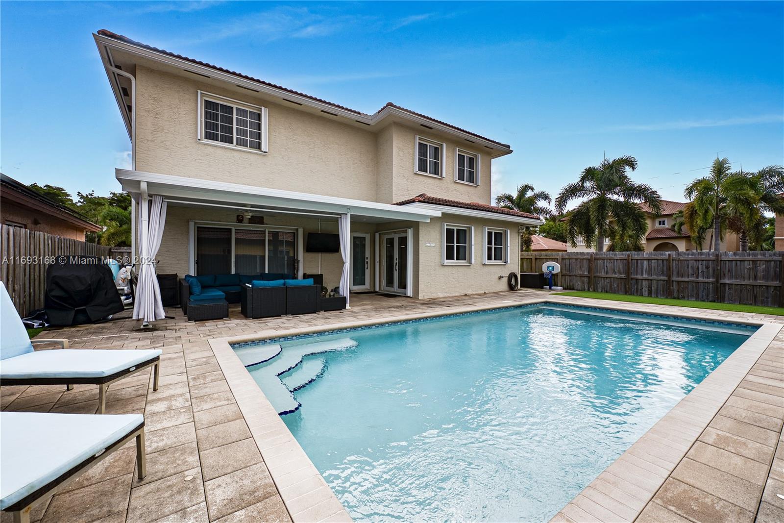 a view of a house with swimming pool