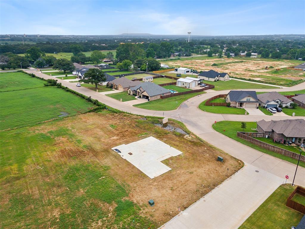 an aerial view of a house with outdoor space swimming pool and lake view