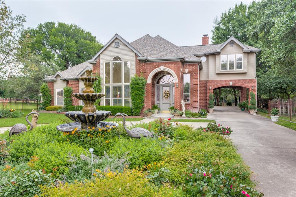 a front view of house with yard and outdoor seating