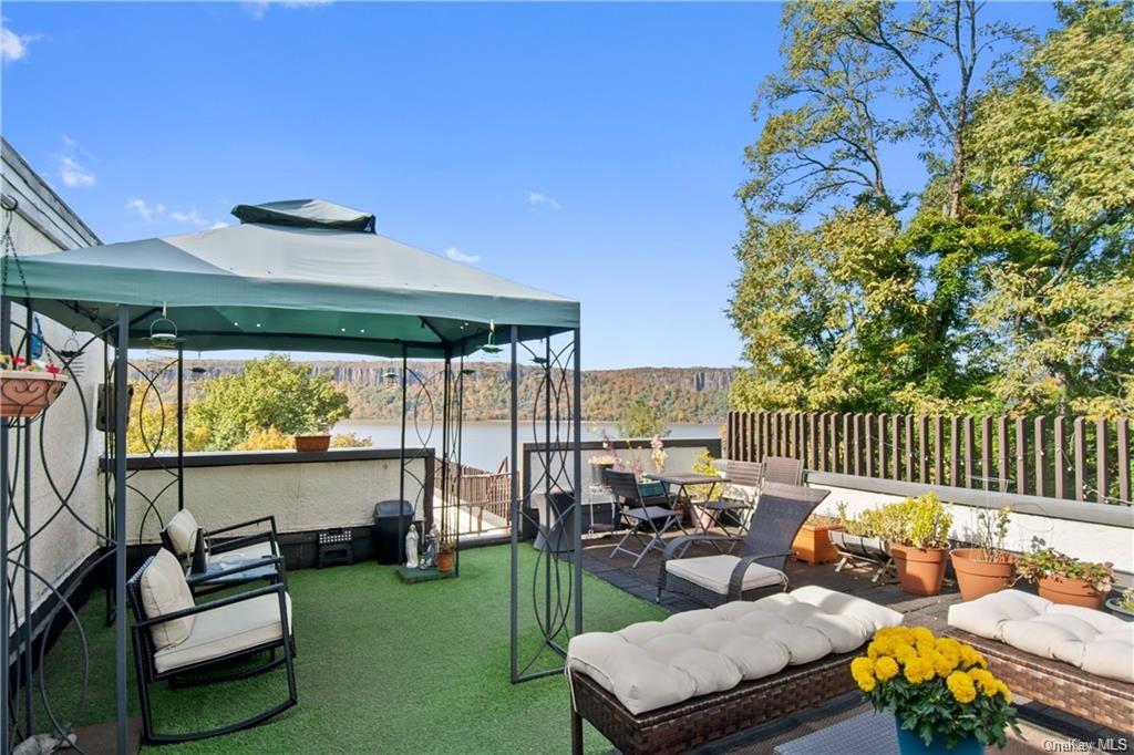 a outdoor living space with furniture and garden view