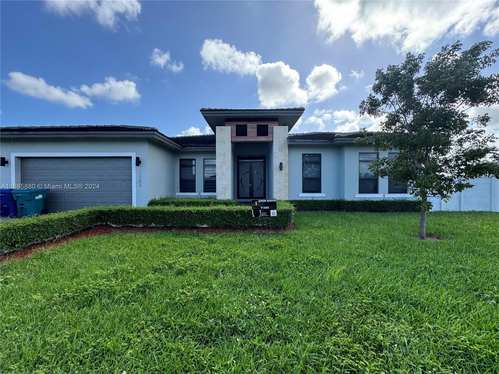 a front view of house with yard and green space