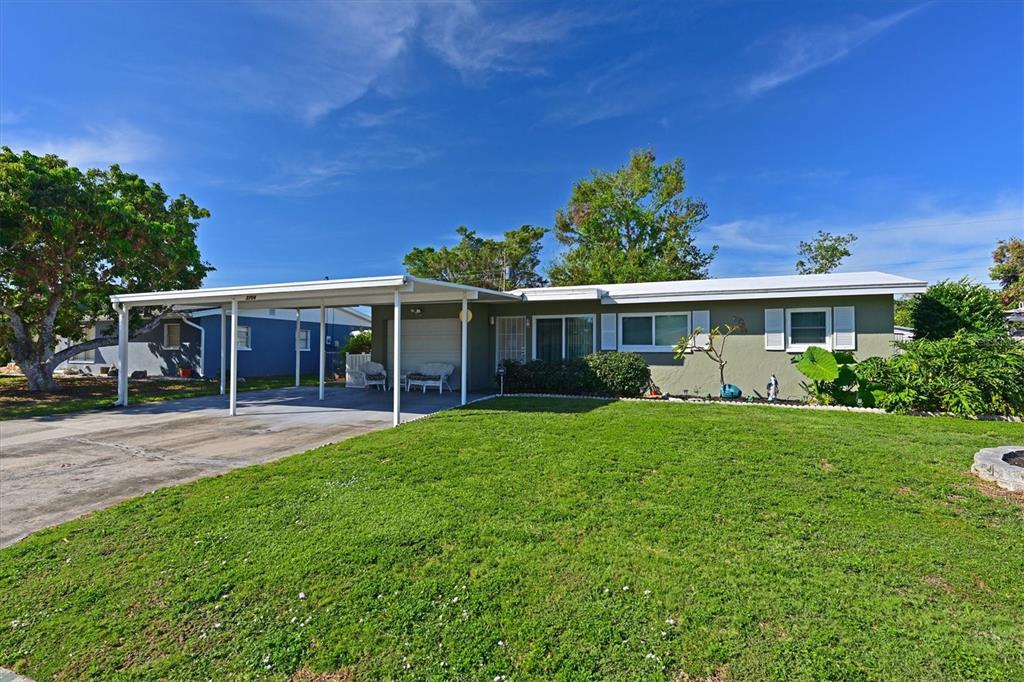 front view of a house with a garden