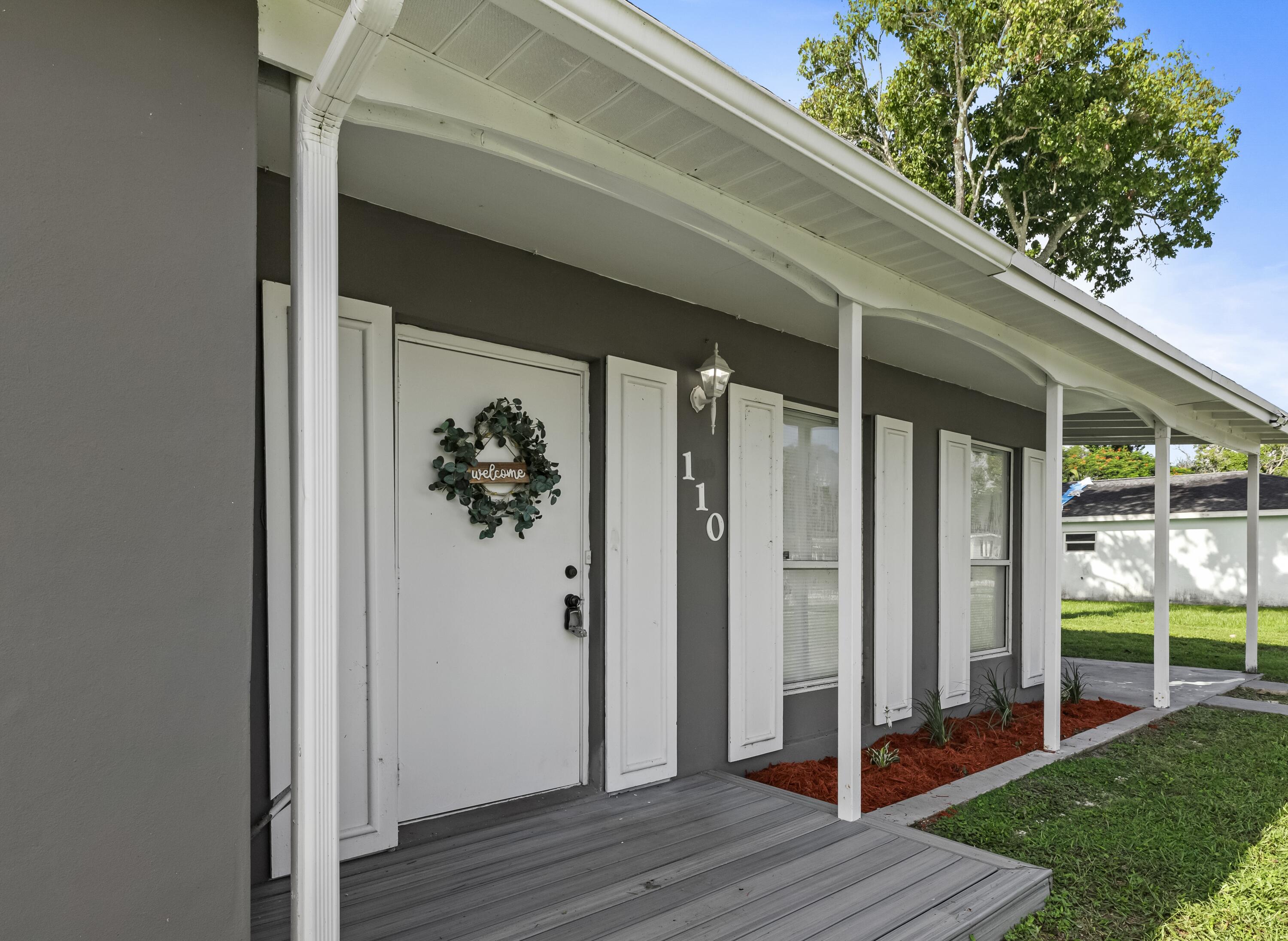 a view of backyard with hardwood floor and deck