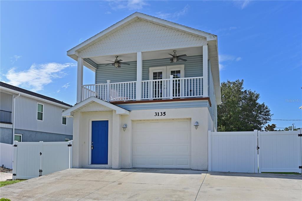 a front view of a house with garage