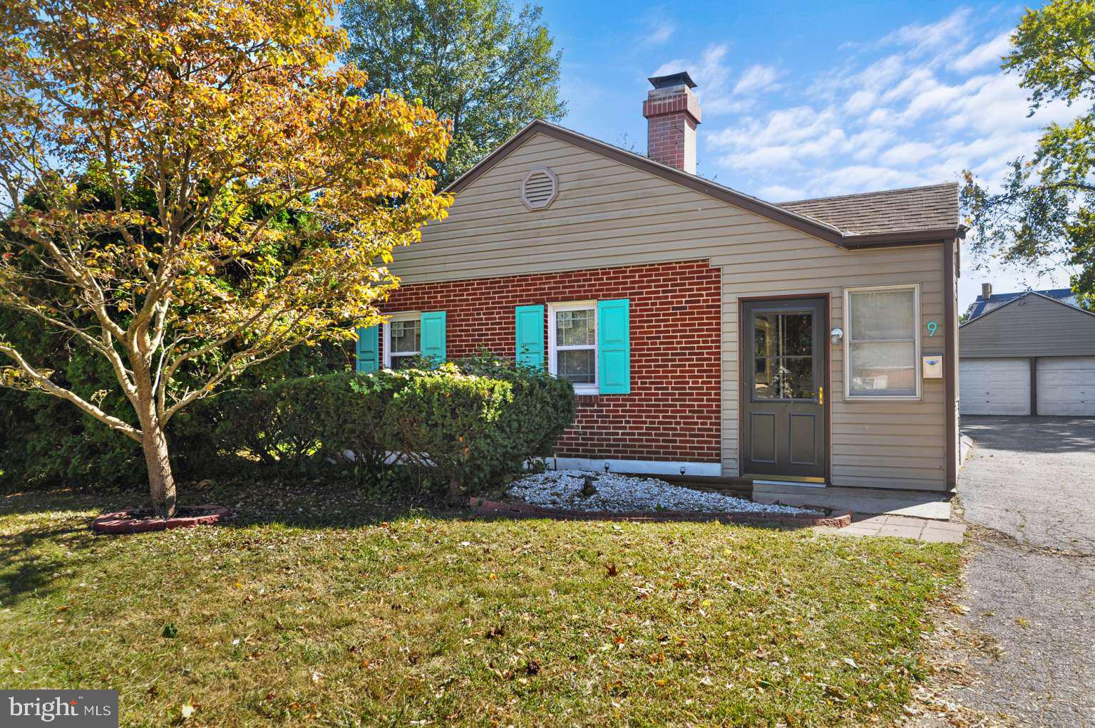 a view of house with yard