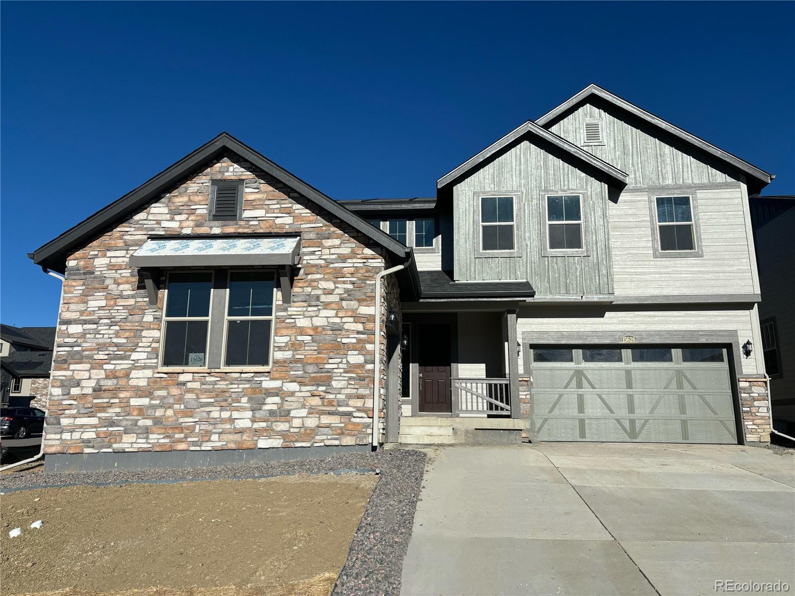 a front view of a house with garage