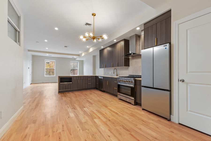 a view of kitchen with cabinets and stainless steel appliances