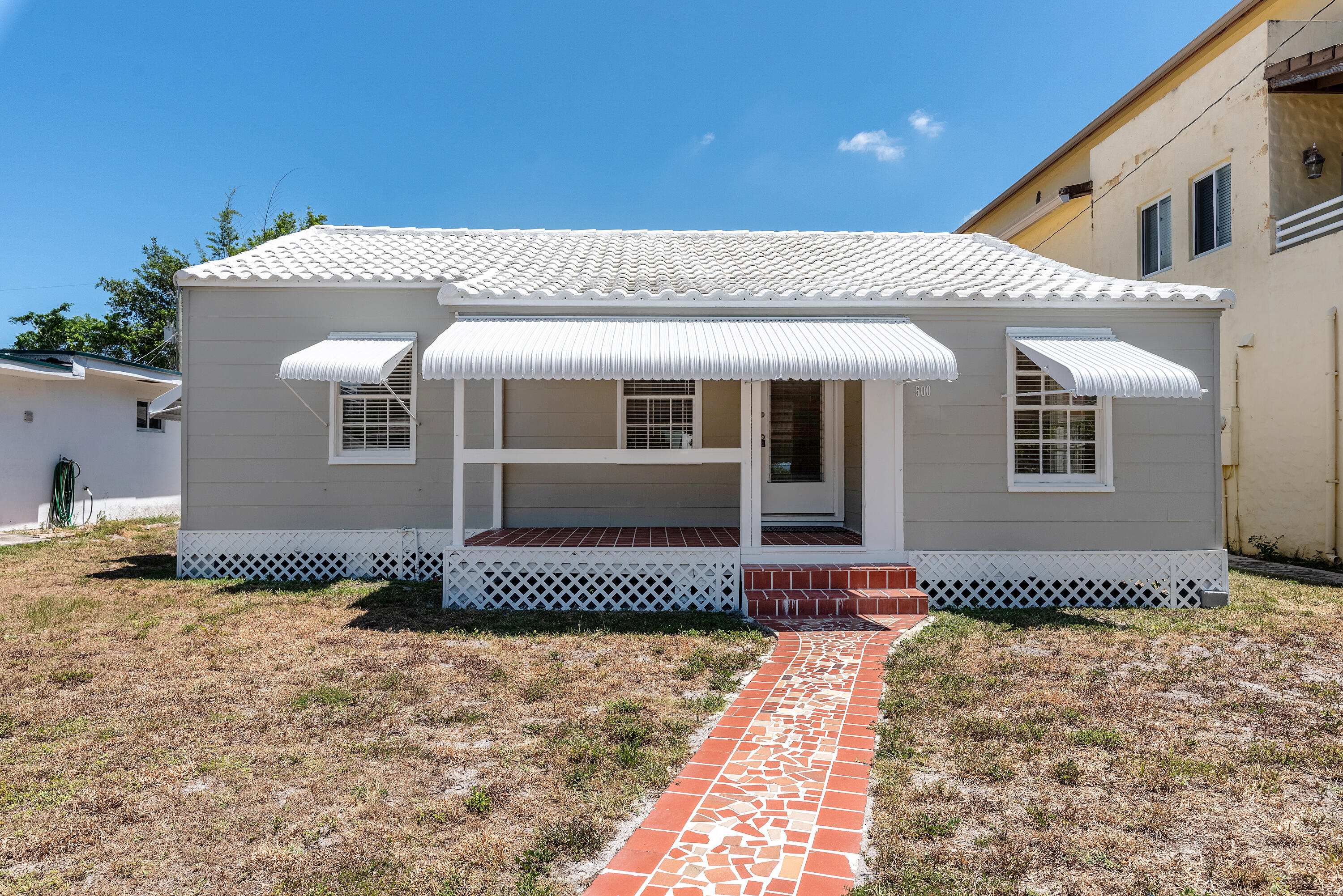 a front view of a house with a outdoor space