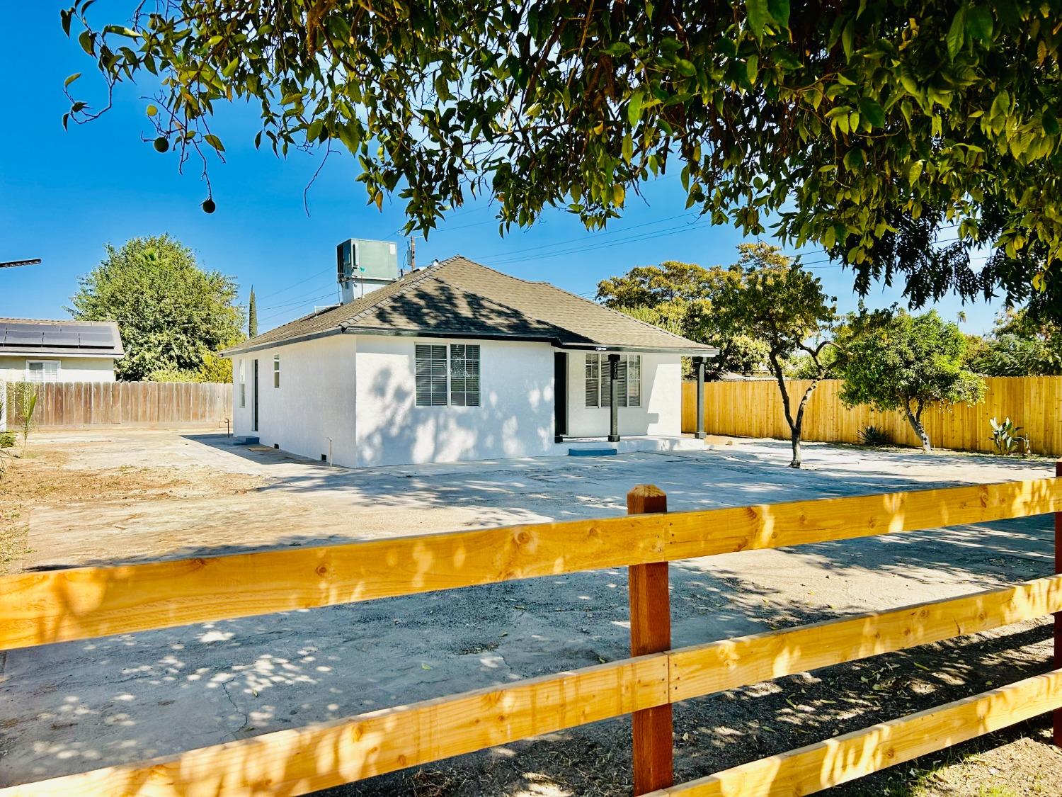 a view of a swimming pool with a house