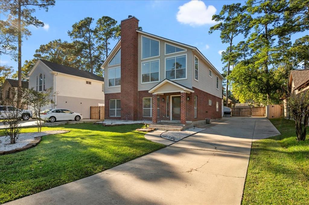 a view of a house with swimming pool and a yard