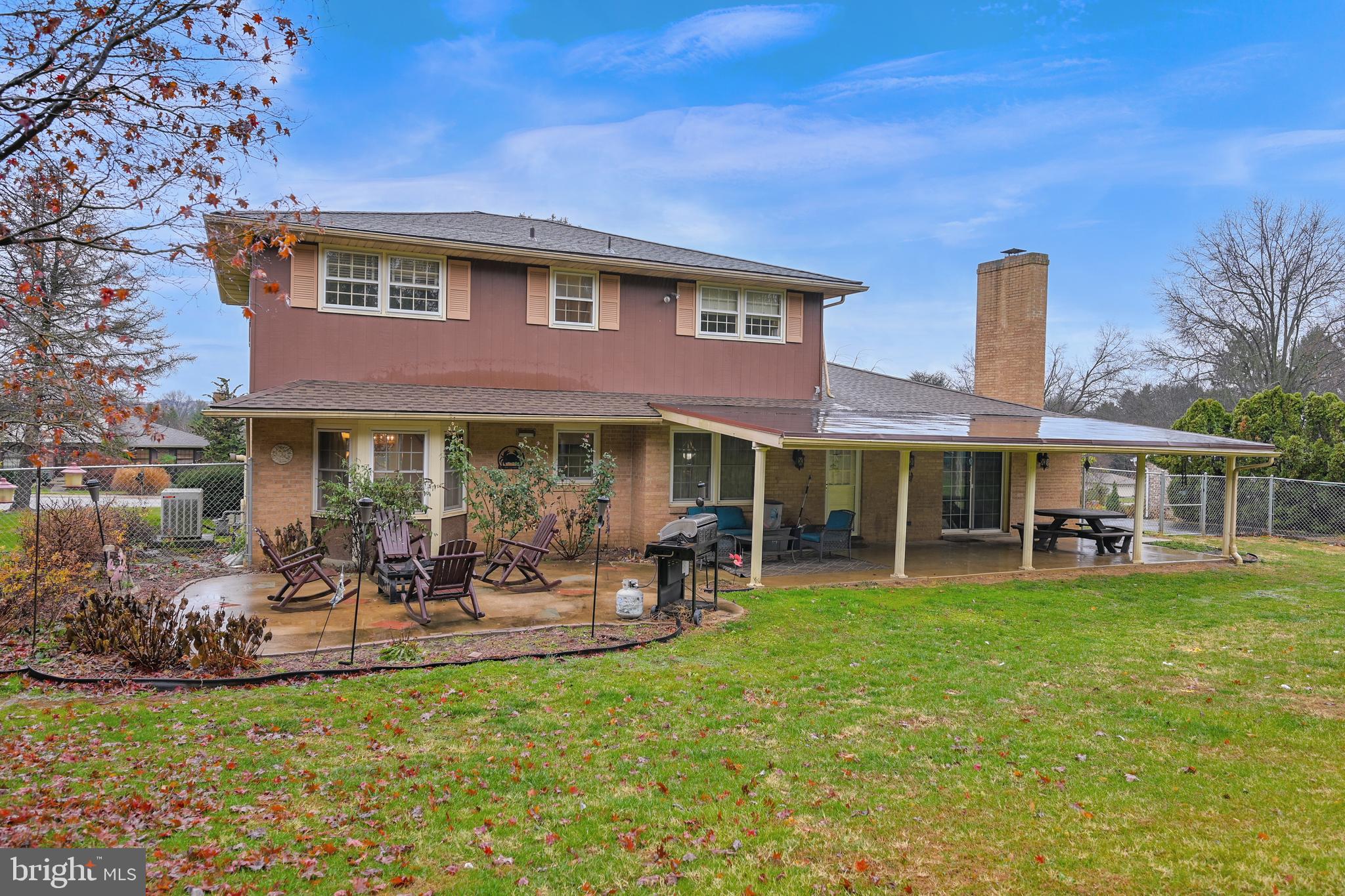 a view of a house with a yard porch and sitting area