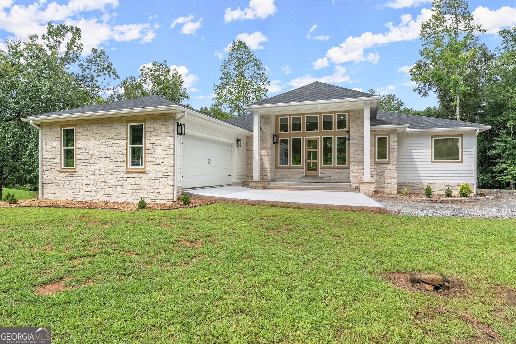 a front view of a house with a yard