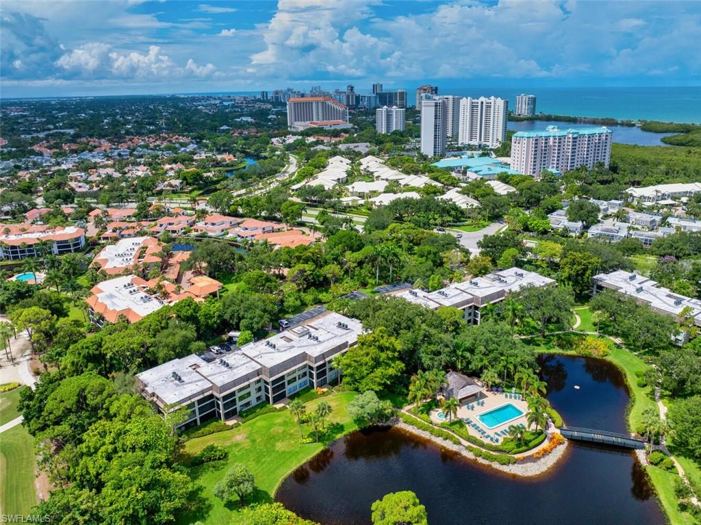 an aerial view of a house with yard swimming pool and outdoor seating