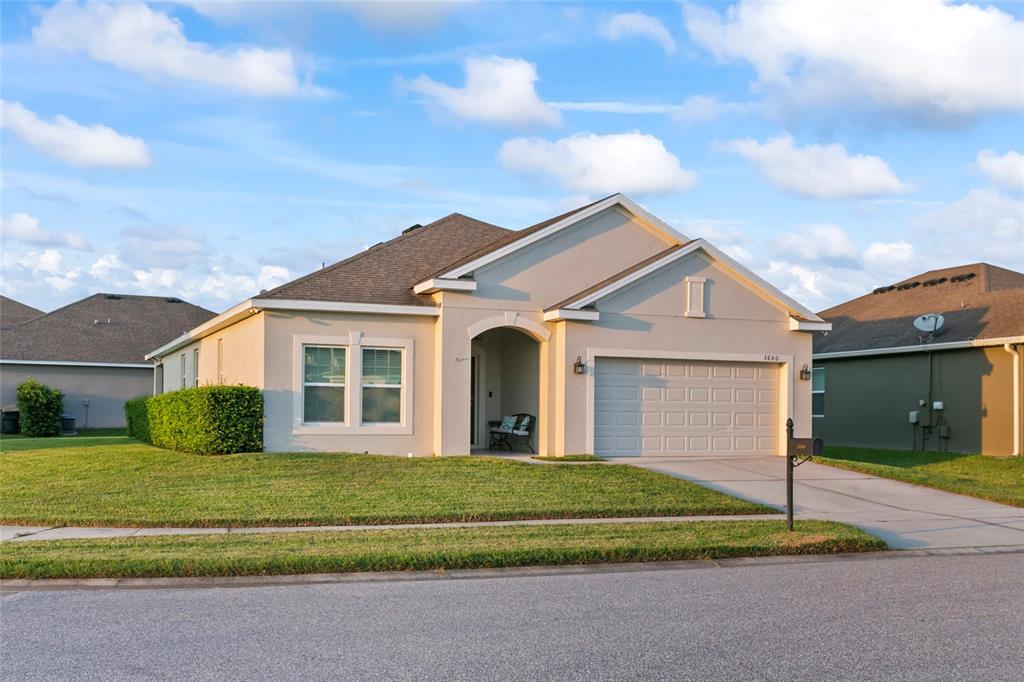 a front view of a house with a yard