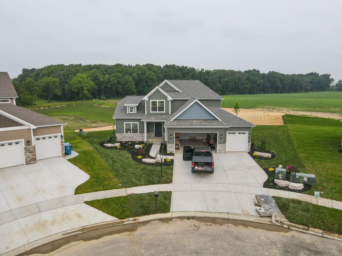 an aerial view of a house with a garden