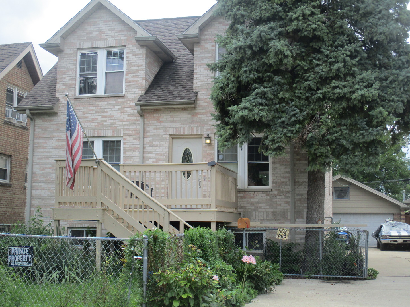 front view of a house with a small yard