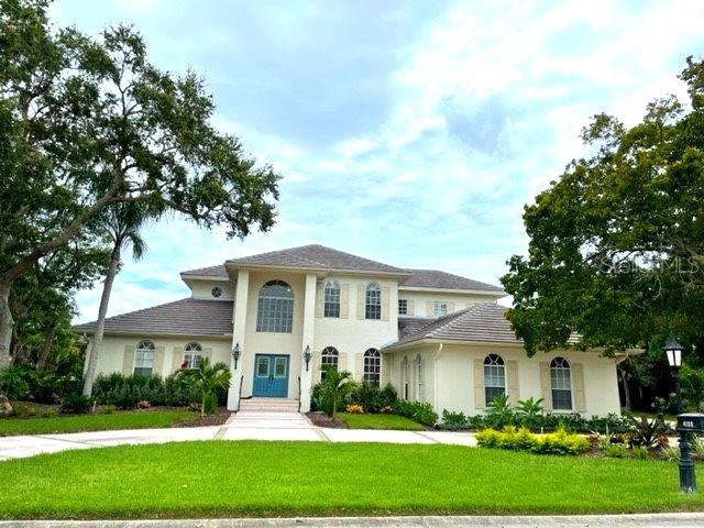 a front view of a house with a yard