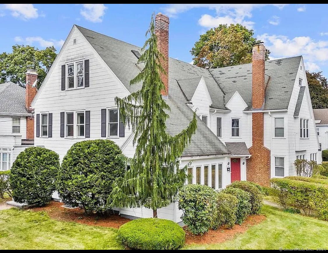 front view of a house with a garden