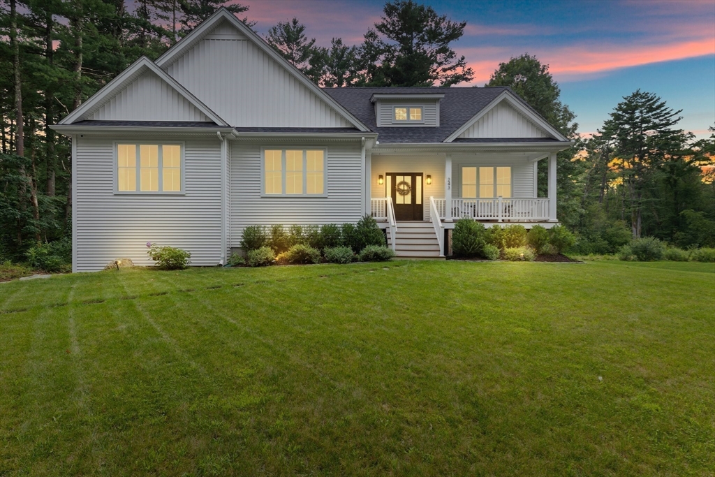 a front view of a house with a yard