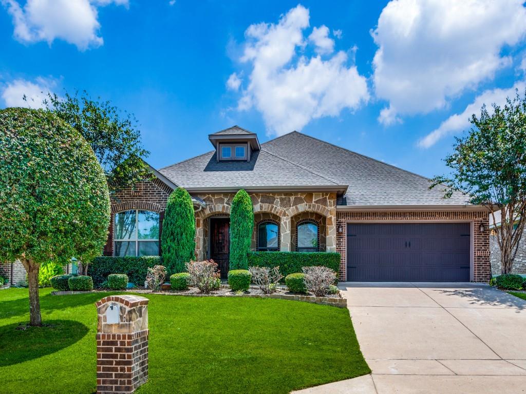 a front view of house with yard and outdoor seating