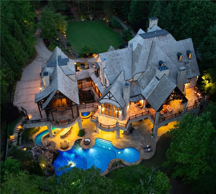 an aerial view of residential house with outdoor space and swimming pool