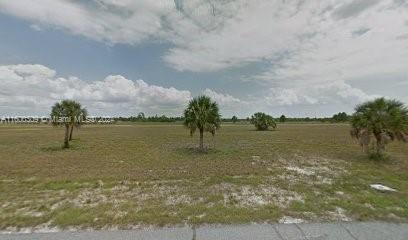 a view of a lake with a big yard