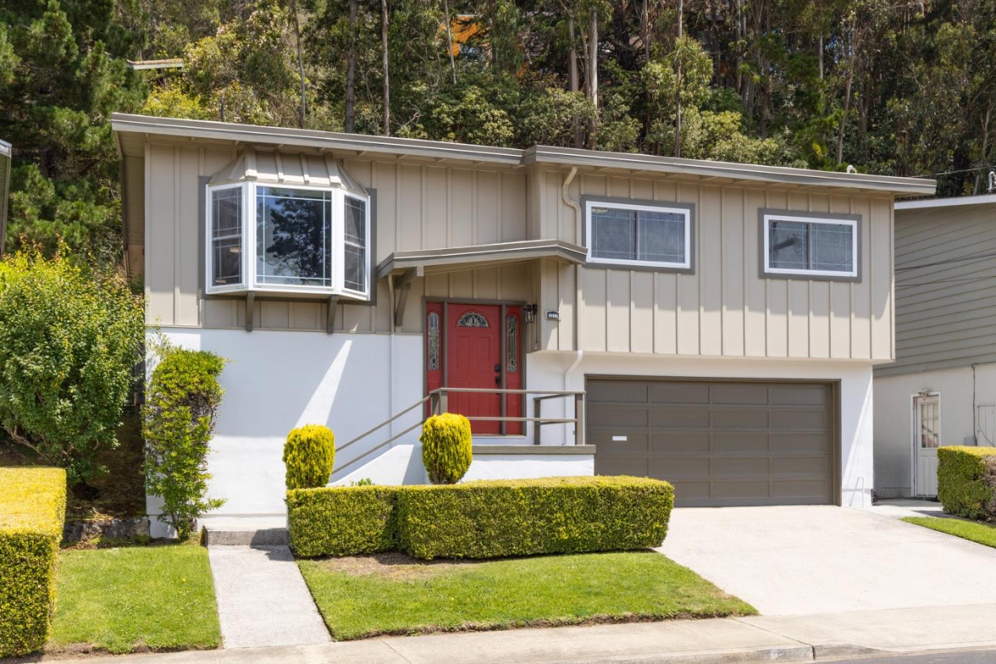 a view of house with outdoor space and porch