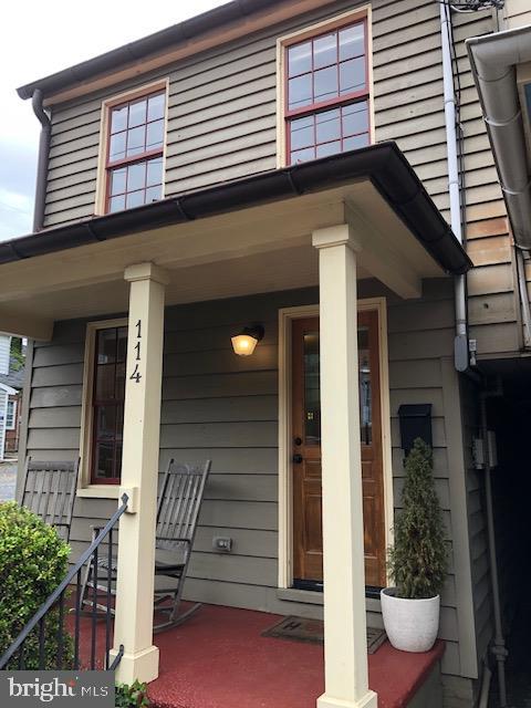 a front view of a house with porch