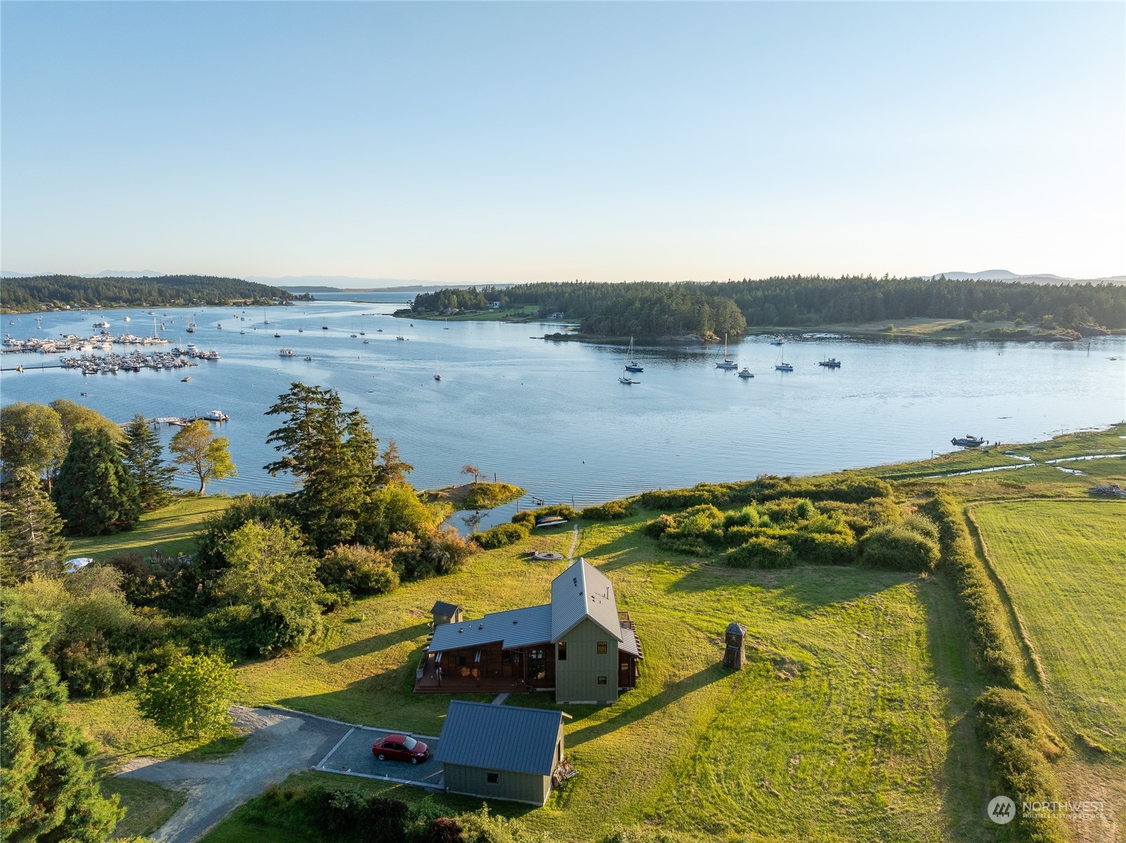 an aerial view of a house with a lake view