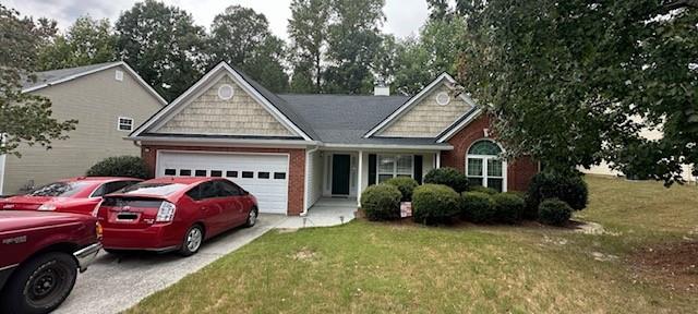 a front view of a house with a garden and plants