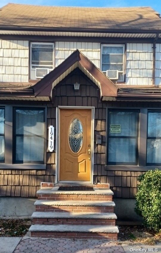 a front view of a house with a porch