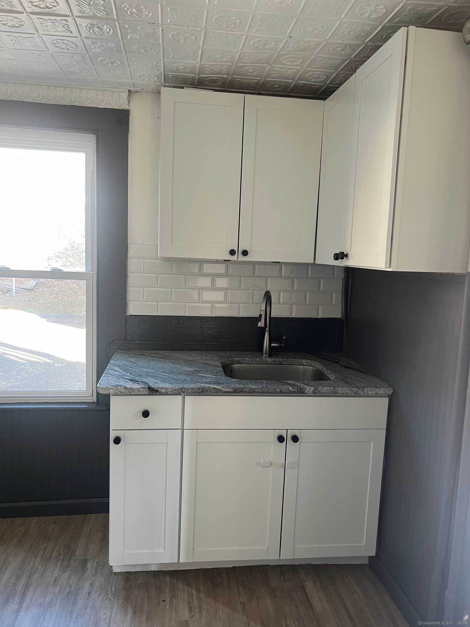 a kitchen with a sink and cabinets