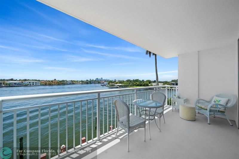 a terrace with outdoor seating and city view