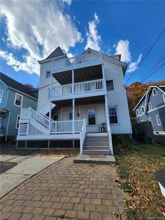 a front view of a house with a balcony