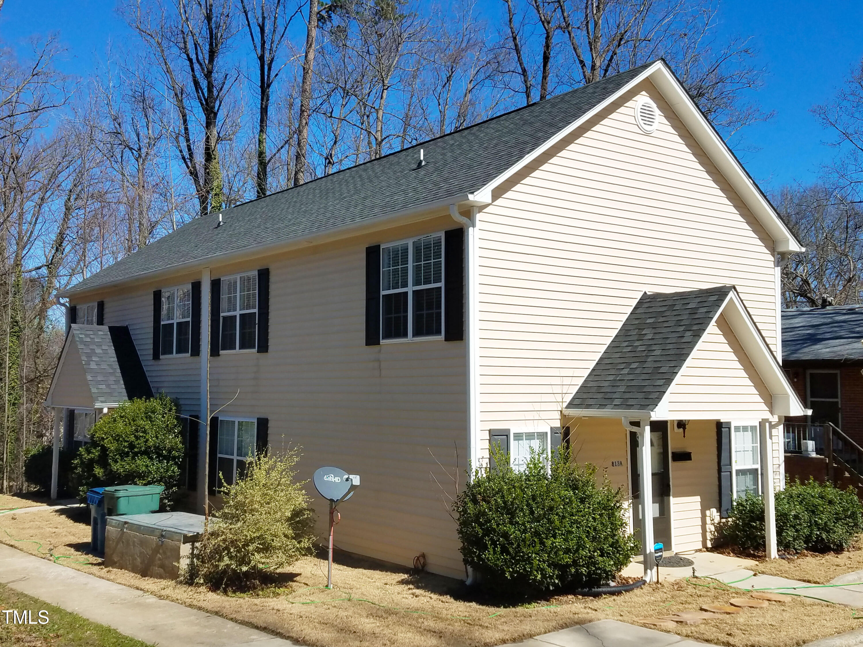 a view of house with yard