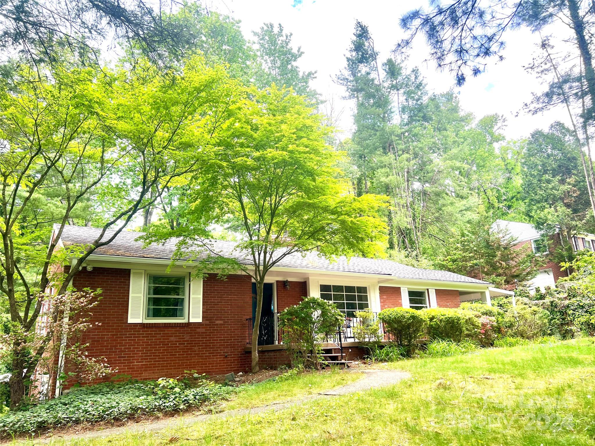 a front view of a house with yard