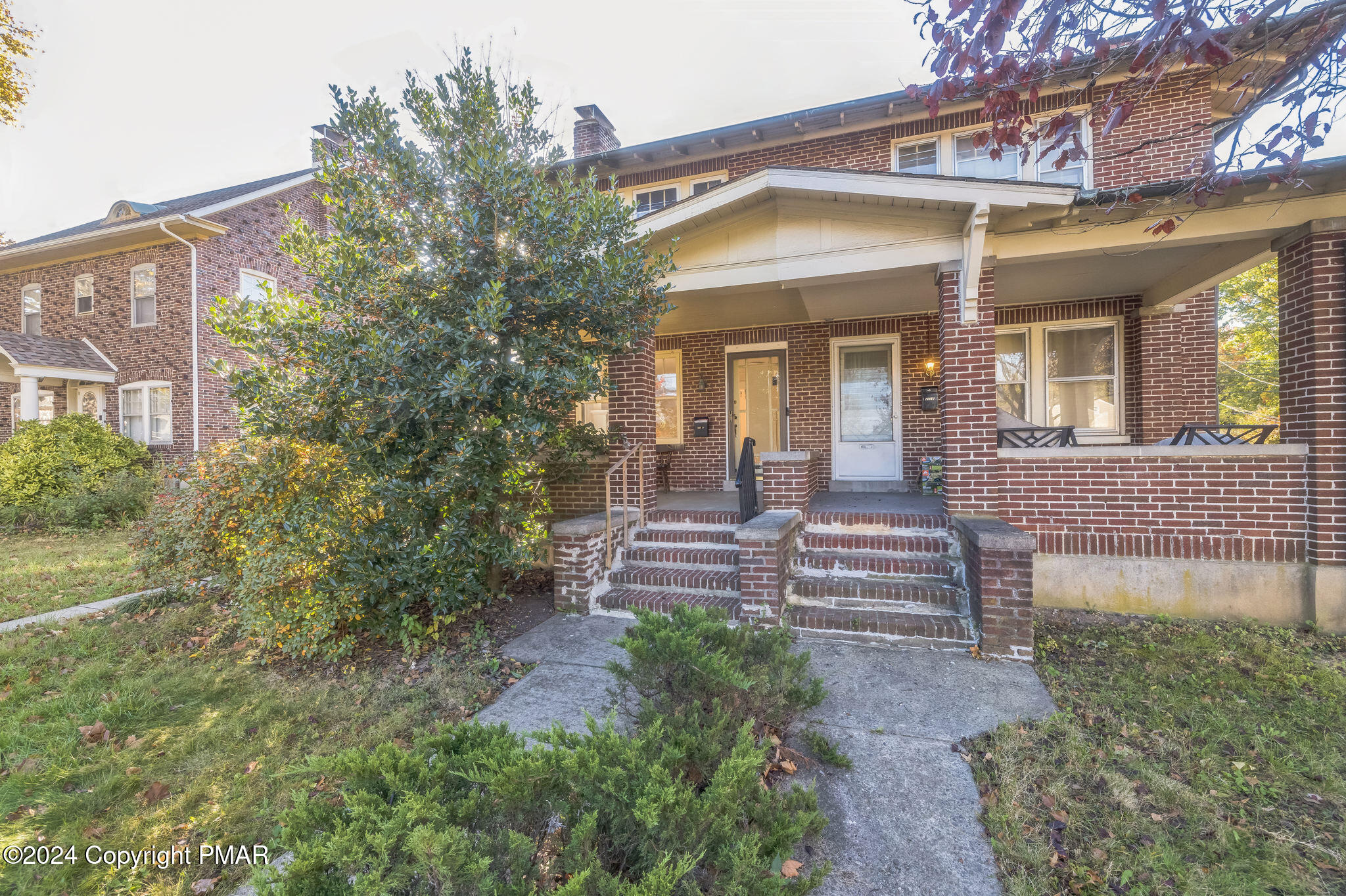 front view of a house with a yard