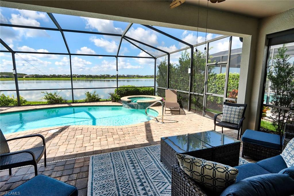 a view of swimming pool with outdoor seating