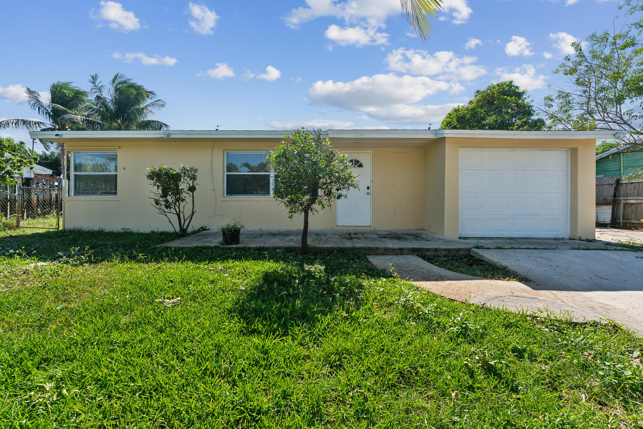 front view of a house with a yard