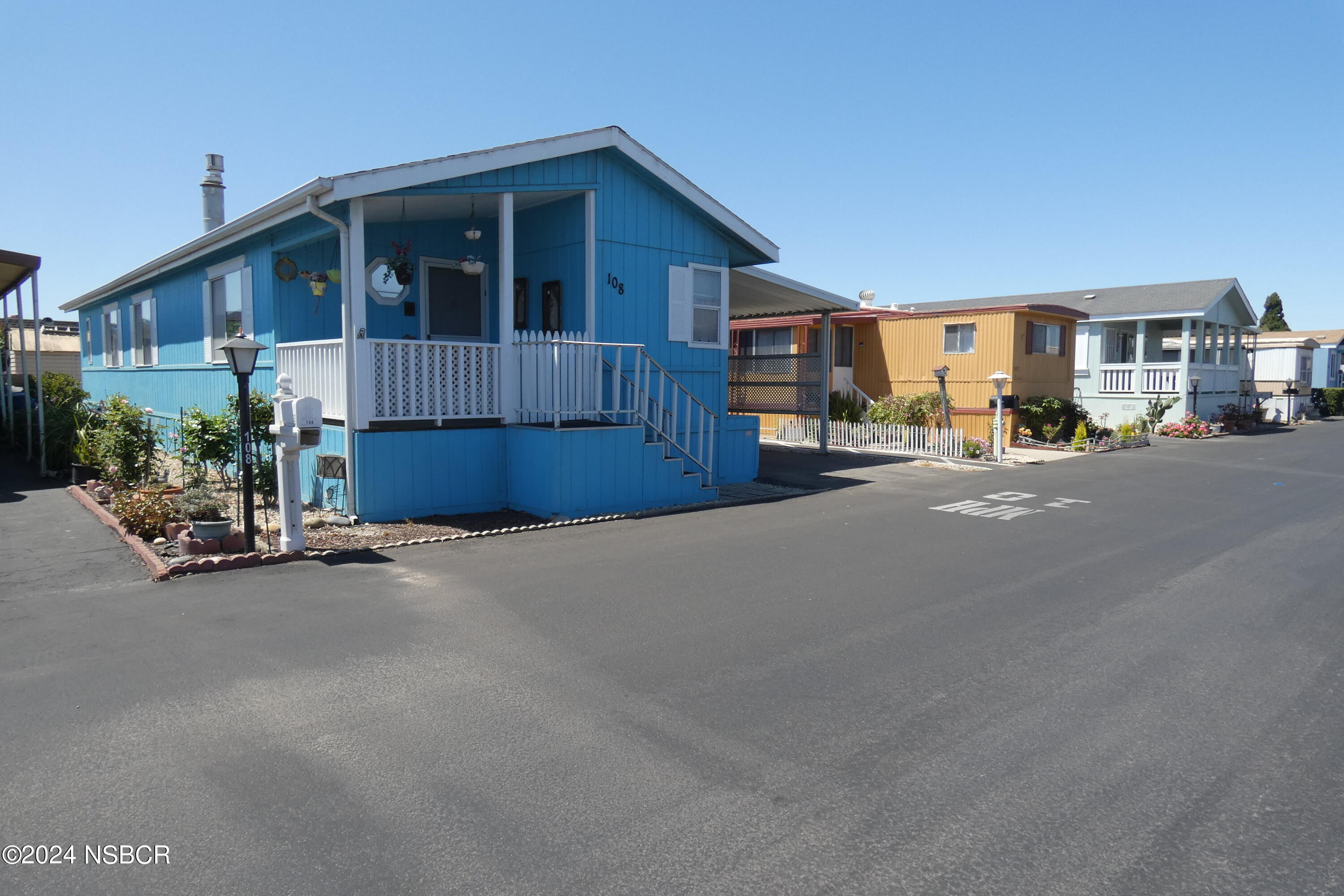 a view of a house with a street