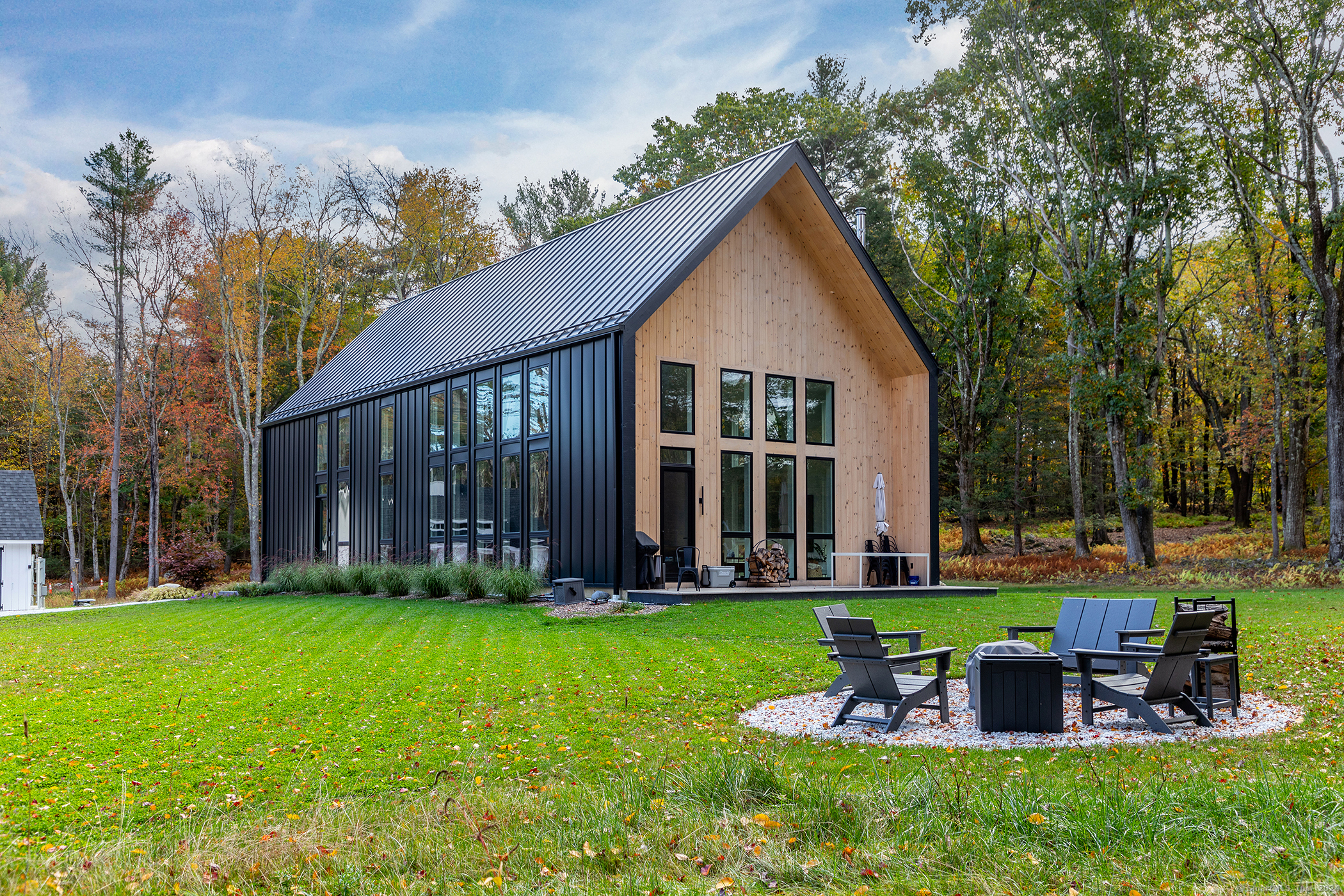 a front view of house with yard outdoor seating and green space