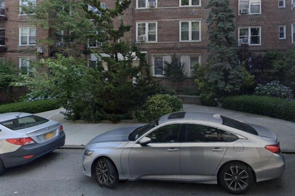 a view of a car parked in front of a house