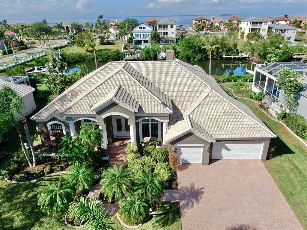 an aerial view of a house with a yard